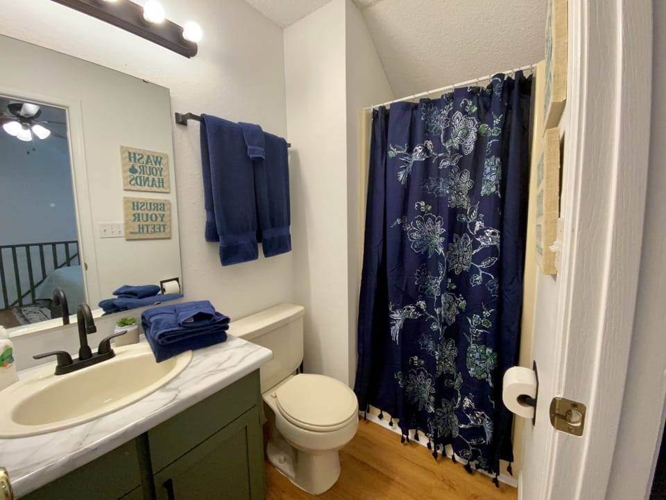 Upstairs bathroom with walk in shower. 