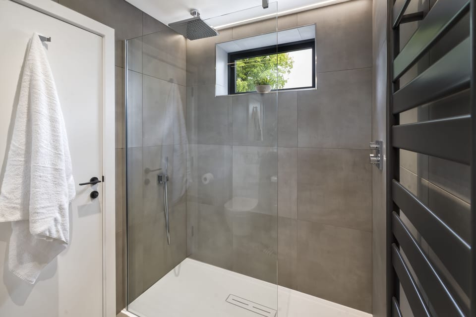 Bedroom 2 - Concrete style bathroom with rain fall shower