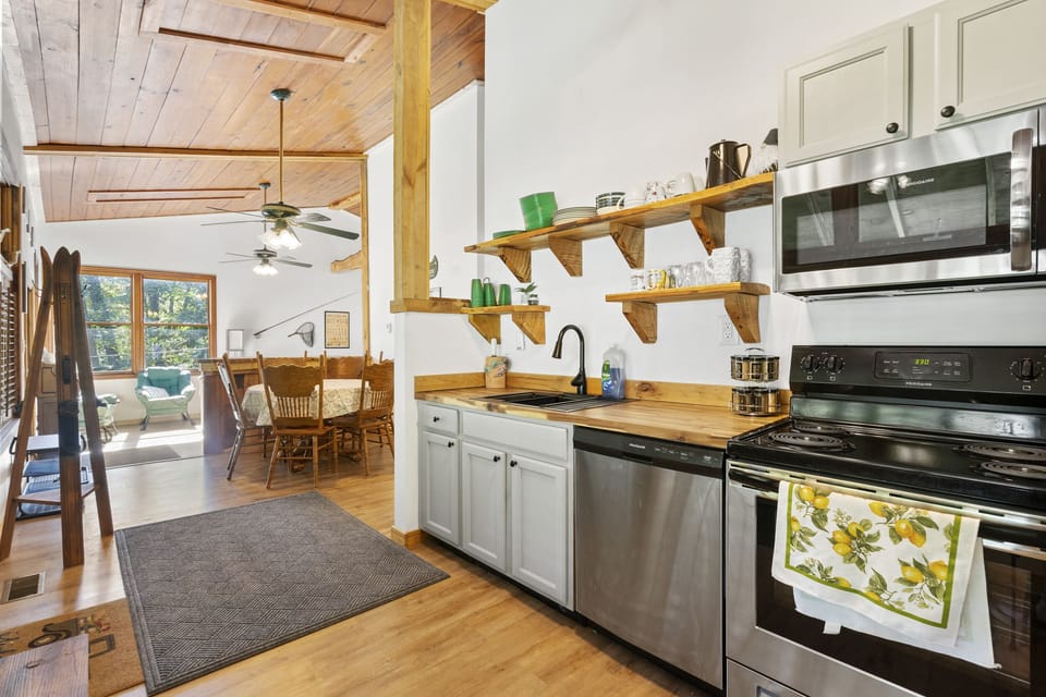 High ceilings and open kitchen/living room make gathering here feel spacious.