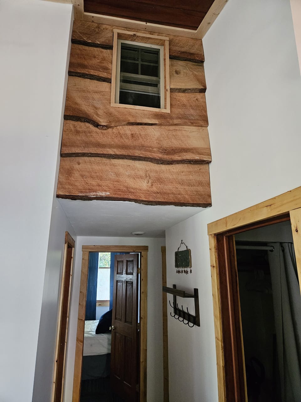 The  indoor treehouse window is above the hallway to the bedrooms and bathrooms.