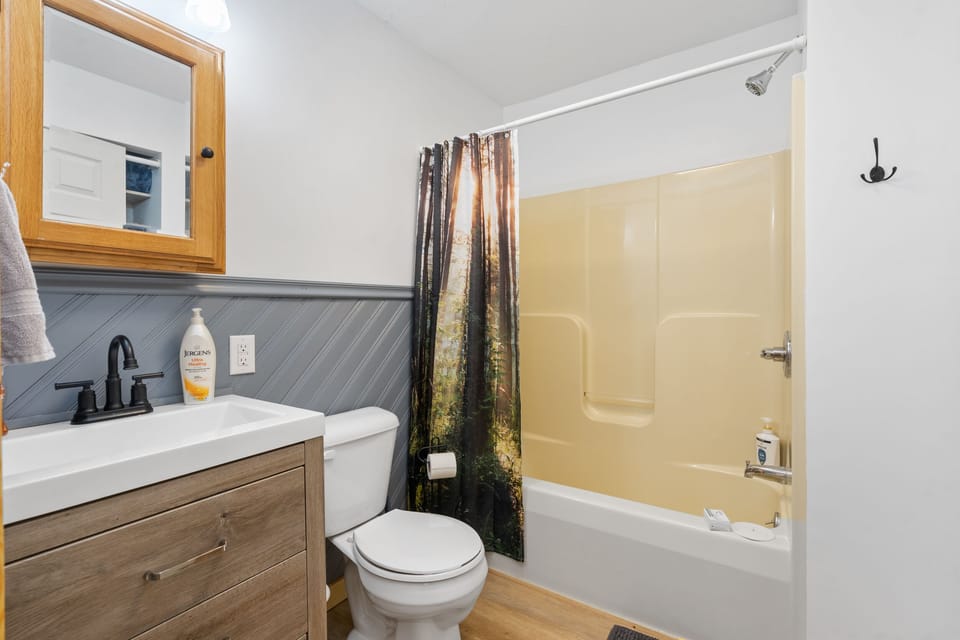 Hall bathroom with tub and shower