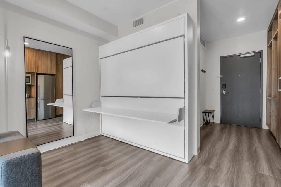 A desk/eating area can be turned into a sleeping space with pull-down twin bunk beds, a great example of the smart design this home features.