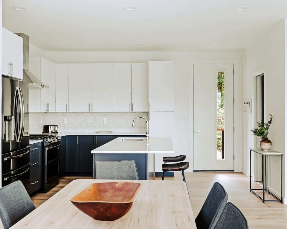 Cook like a pro in the fully equipped chef’s kitchen featuring a gas range, quartz countertops, and modern two-tone cabinetry.