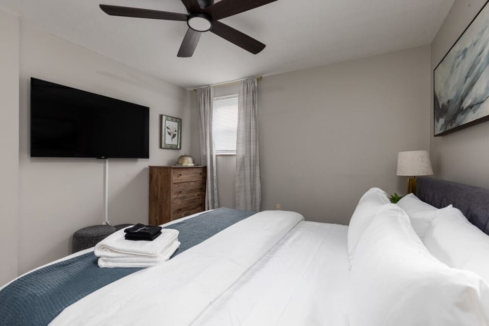 Enjoy television from the cozy confines of your bed