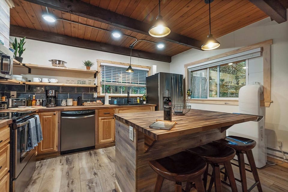 This fully stocked kitchen with butcher block counters and a large island is a great start to some great cooking experiences! Bon Appetit!!