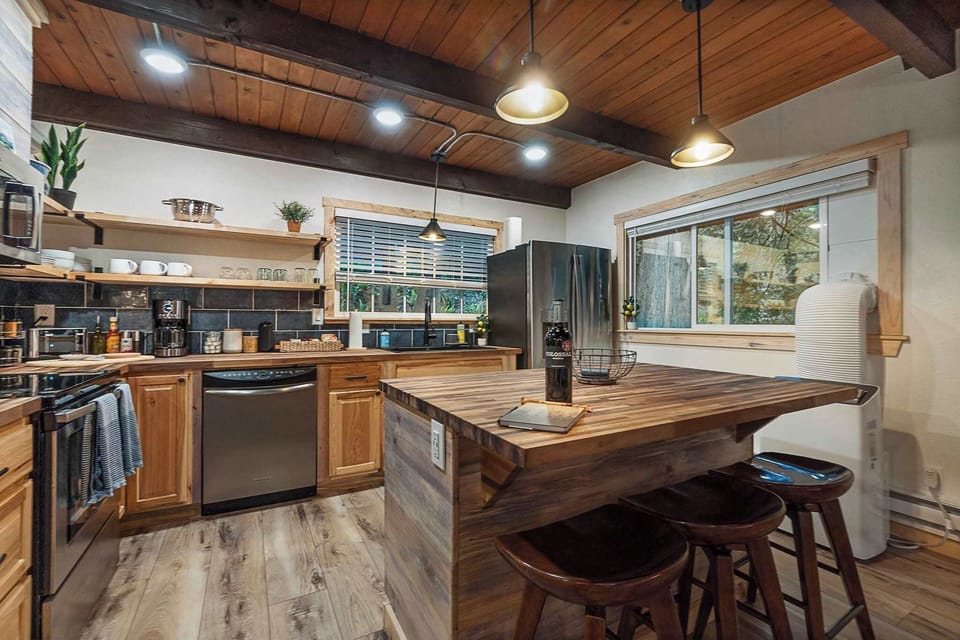 This fully stocked kitchen with butcher block counters and a large island is a great start to some great cooking experiences! Bon Appetit!!