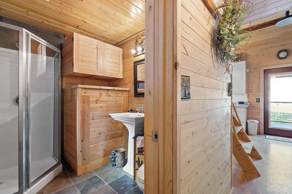 The 3/4 bath is stocked with plush towels and organic shower products. 