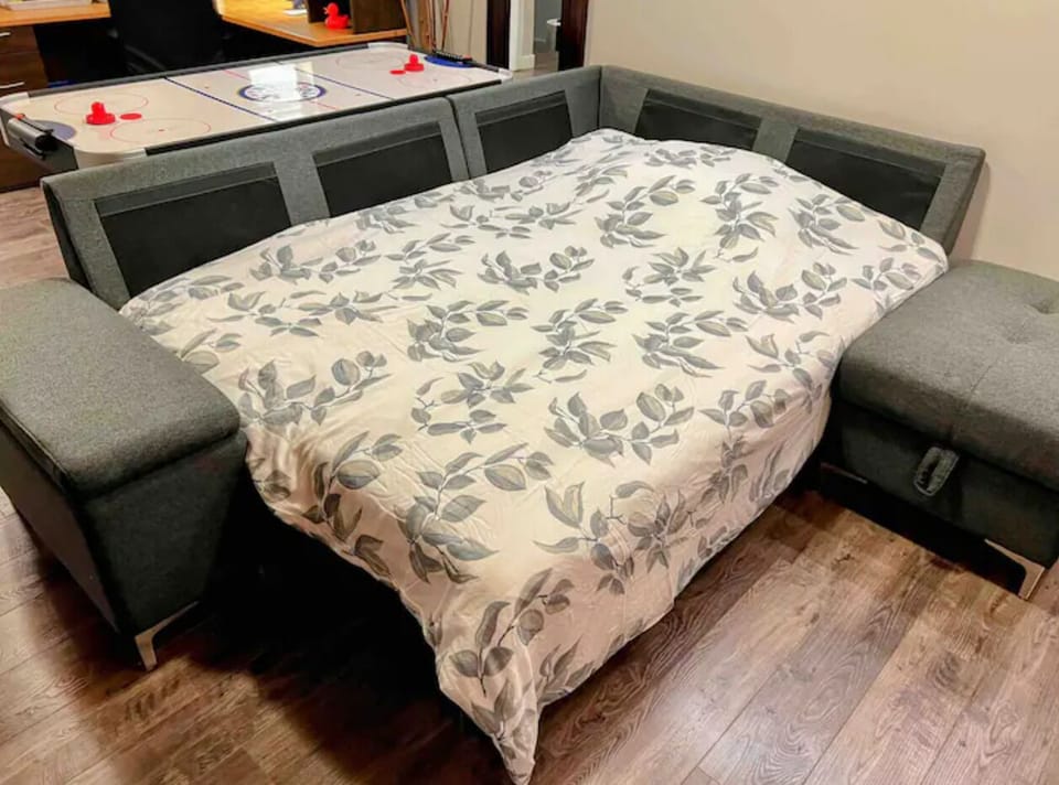 Comfortable sectional sofa converts to a double bed—perfect for children!