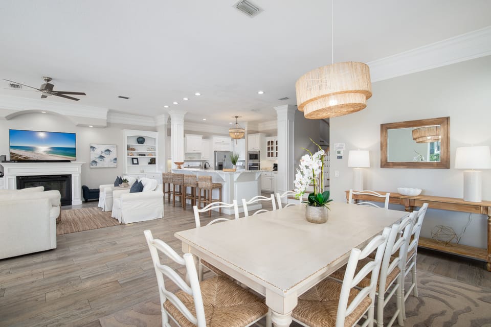 Gather around your spacious dining table in this bright, airy space that flows seamlessly into the kitchen and living areas.