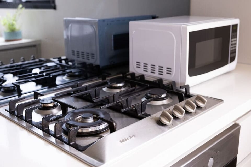 Thoughtfully designed with essential amenities, including a high-quality gas cooktop for cooking delicious meals and microwave.