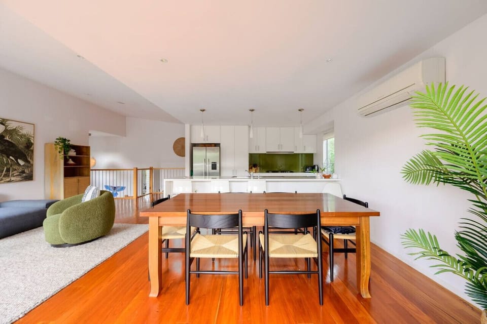 Open-plan, well-organized dining, living, and kitchen area.