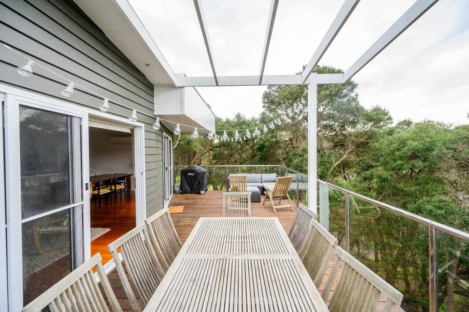 Upstairs there is an additional seating area. Includes 8 seater wooden dining table, couch and a BBQ.