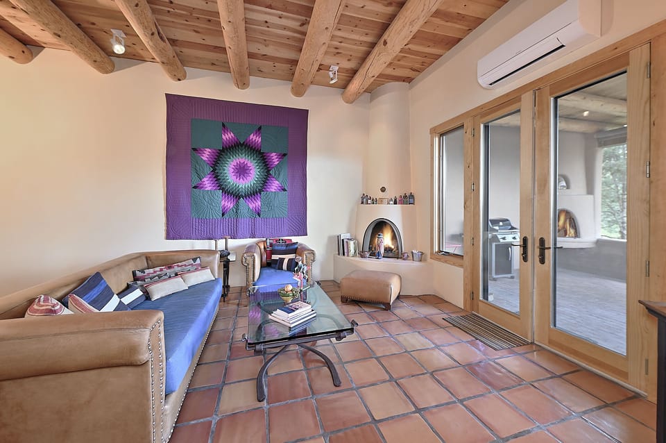 Living room with views toward patio.  Fireplace may be used responsibly.