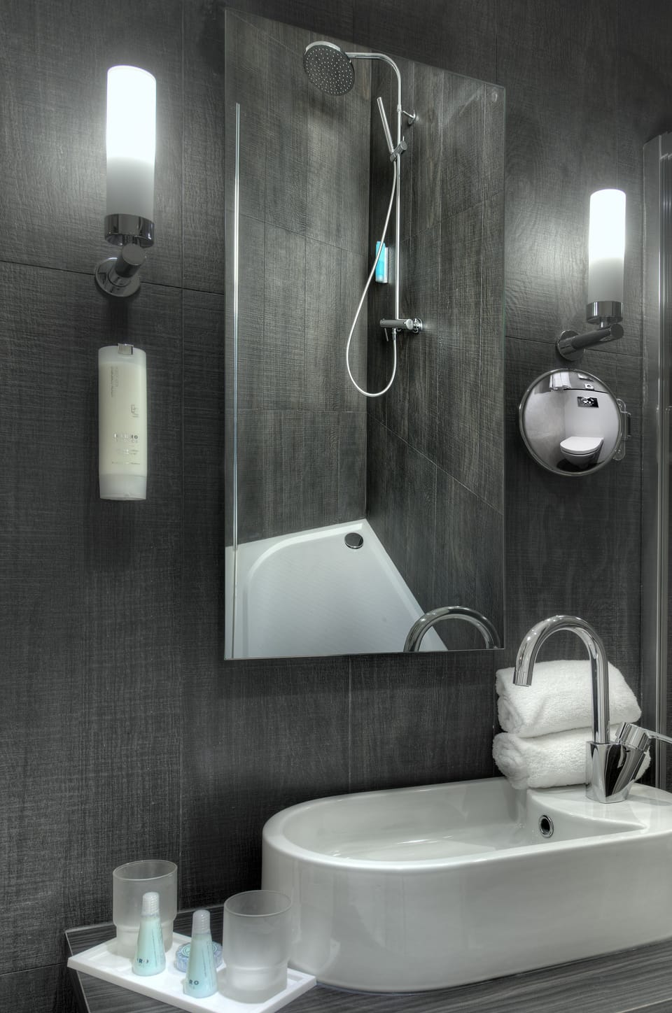 Eco-friendly toiletries, hair dryer, slippers, towels