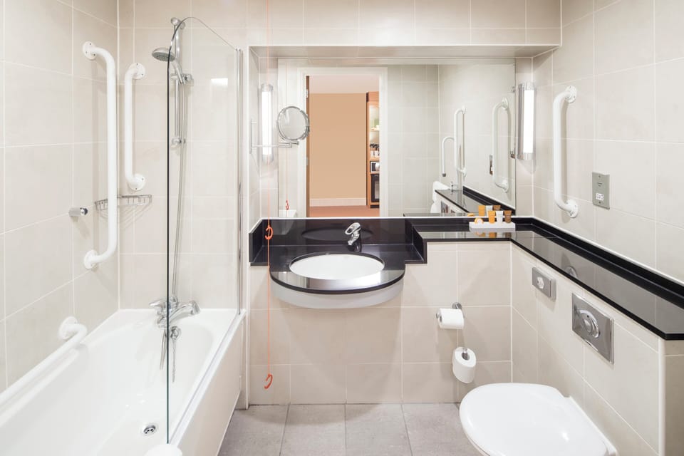 Premium Room, Multiple Beds | Bathroom | Combined shower/tub, deep soaking tub, eco-friendly toiletries