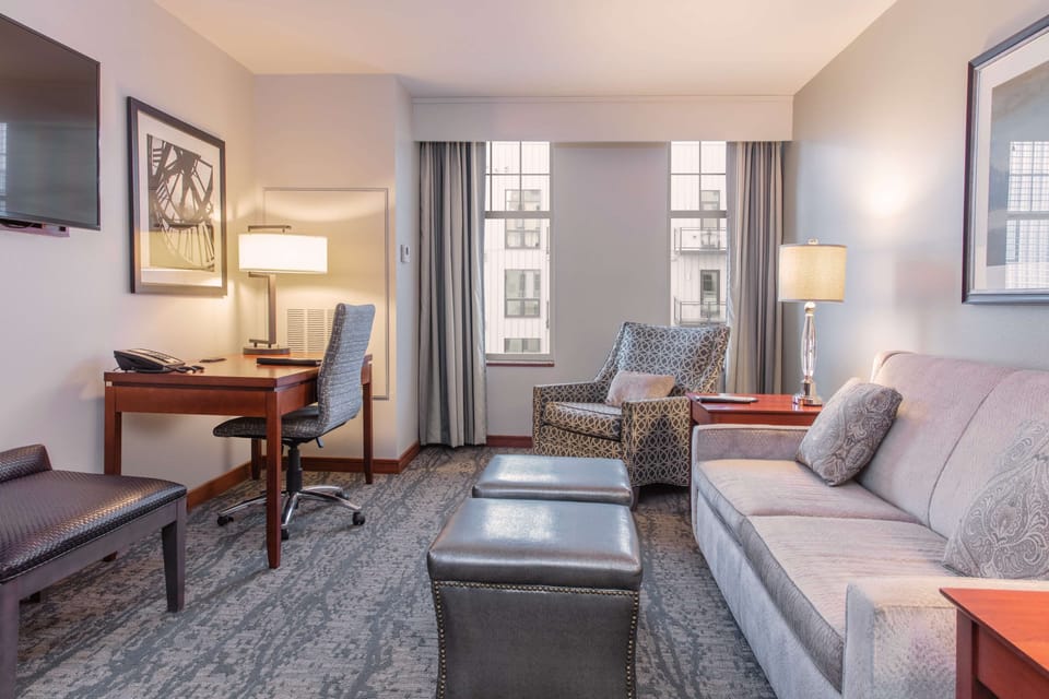 Suite, 1 King Bed, Non Smoking, Jetted Tub (Living Room;with Sofabed) | Premium bedding, minibar, in-room safe, iron/ironing board