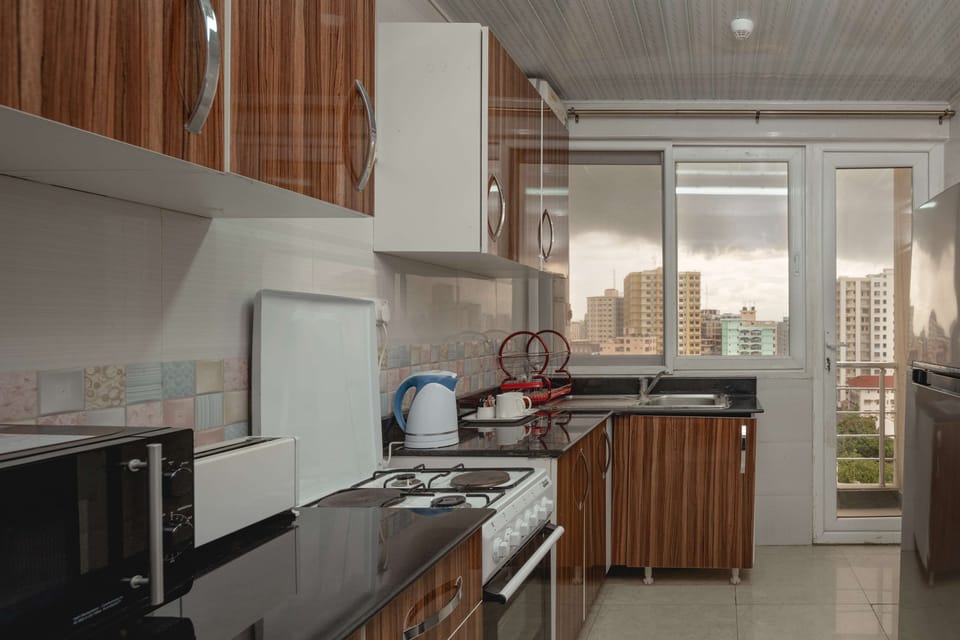 Family Suite, Multiple Beds, Kitchen | Private kitchenette | Coffee/tea maker, electric kettle, eco-friendly cleaning products