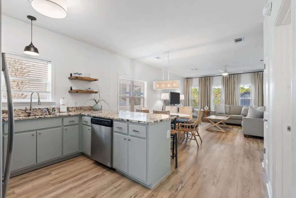 - Cook, dine, and unwind with ease in this open concept space made for togetherness - Granite kitchen island flows into the dining & living areas, perfect for connection - From morning coffee to evening laughter, every moment feels effortlessly invit