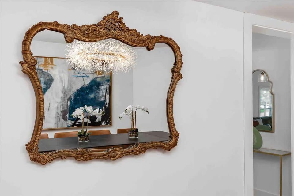 Decorative gold mirror detail in dining area.