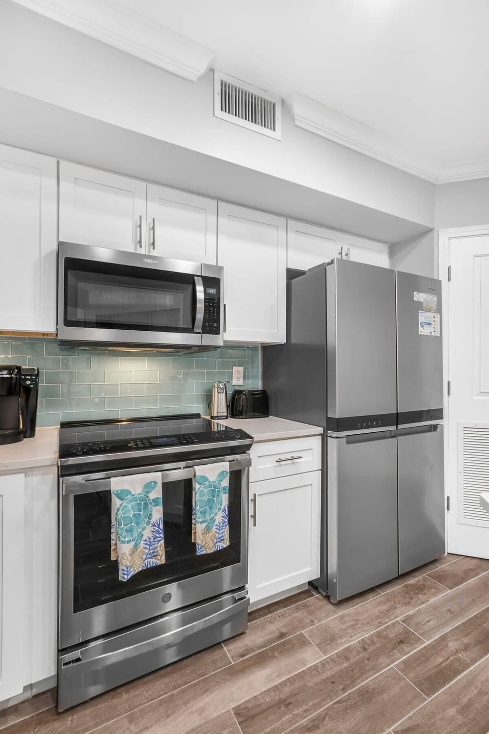 Stainless appliances & tile backsplash