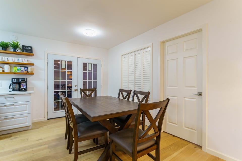 Dining area with door leading to the backyard