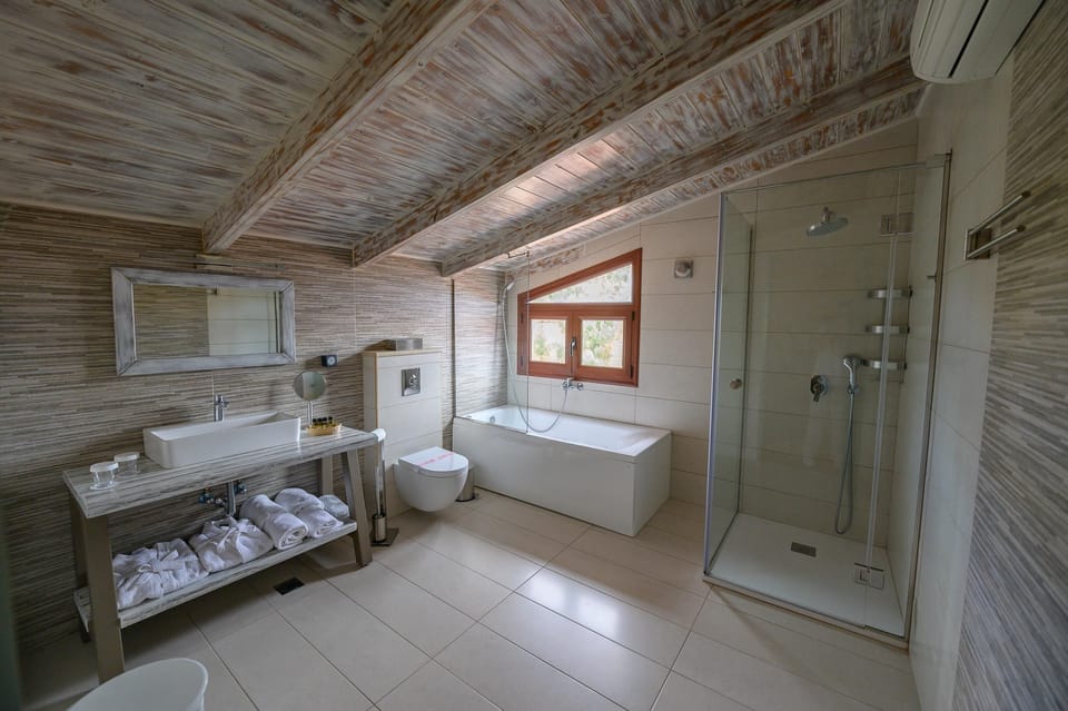 Superior Apartment, Non Smoking, Valley View | Bathroom | Combined shower/tub, free toiletries, hair dryer, bathrobes
