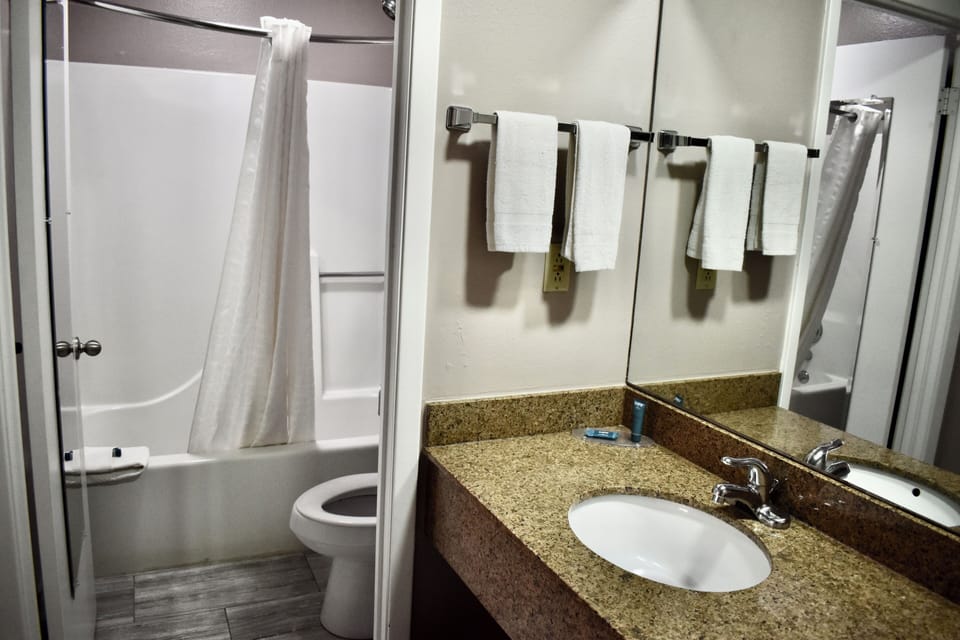 Room, 2 Double Beds | Bathroom | Combined shower/tub, deep soaking tub, free toiletries, hair dryer