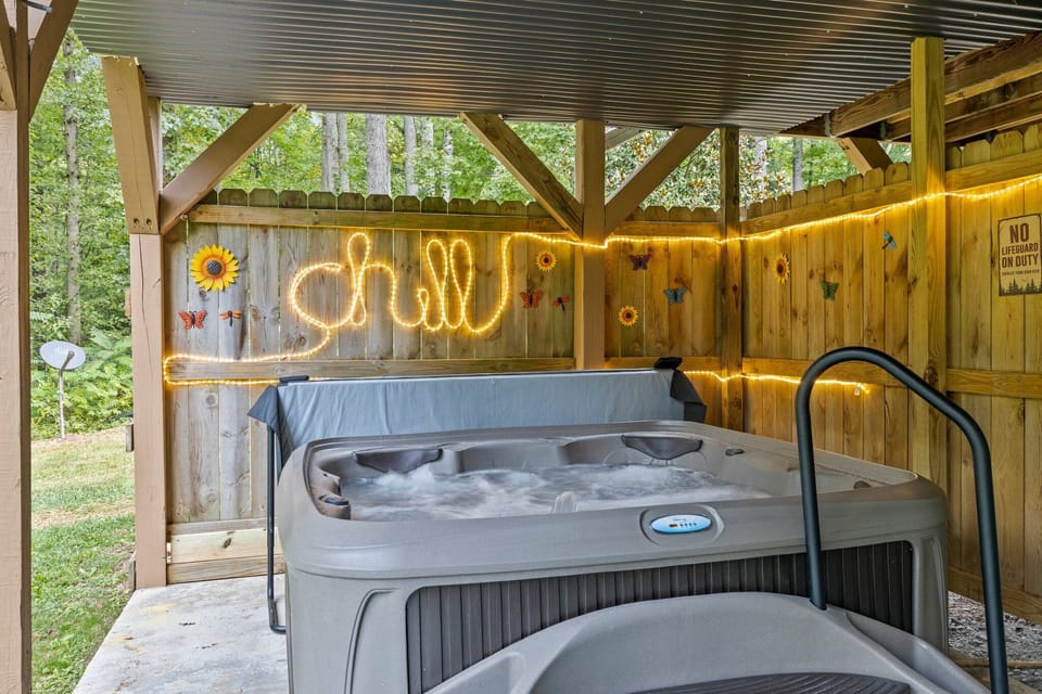 Relax & enjoy the hot tub rain or shine under our covered porch