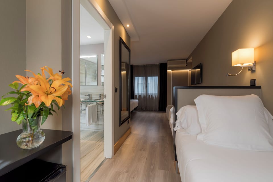 Family Quadruple Room | Premium bedding, minibar, in-room safe, individually decorated