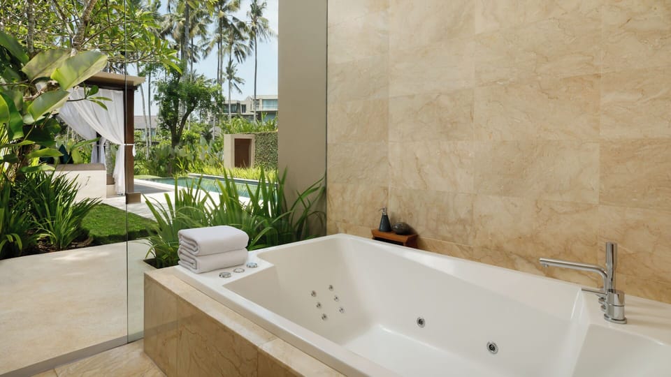 Luxury Villa, 1 Bedroom, Pool View | Bathroom | Combined shower/tub, free toiletries, hair dryer, slippers