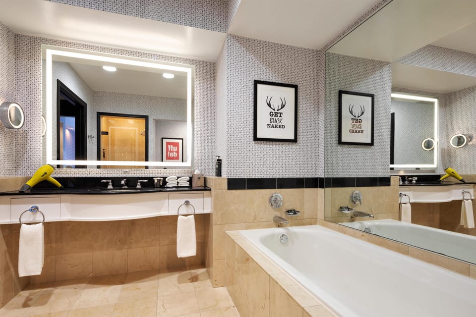 Suite, 1 Bedroom | Bathroom | Combined shower/tub, designer toiletries, hair dryer, bathrobes