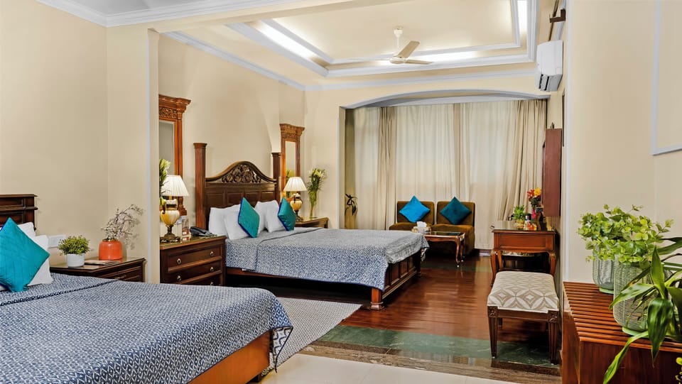Family Room with Airport Pickup | Select Comfort beds, in-room safe, individually decorated