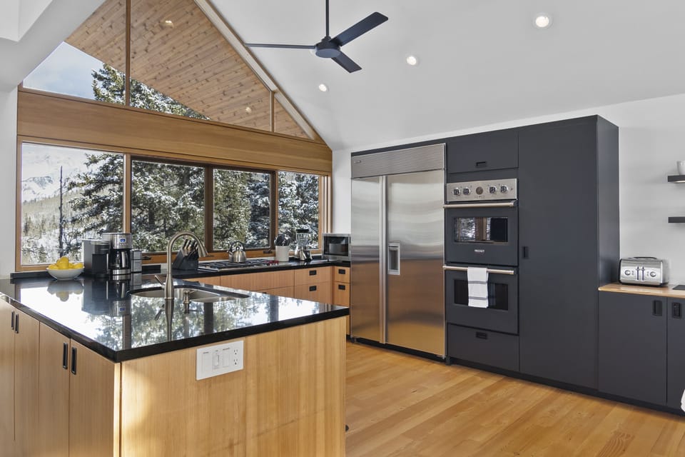 This incredible kitchen features top of the art appliances, stunning views and an open concept cooking area.