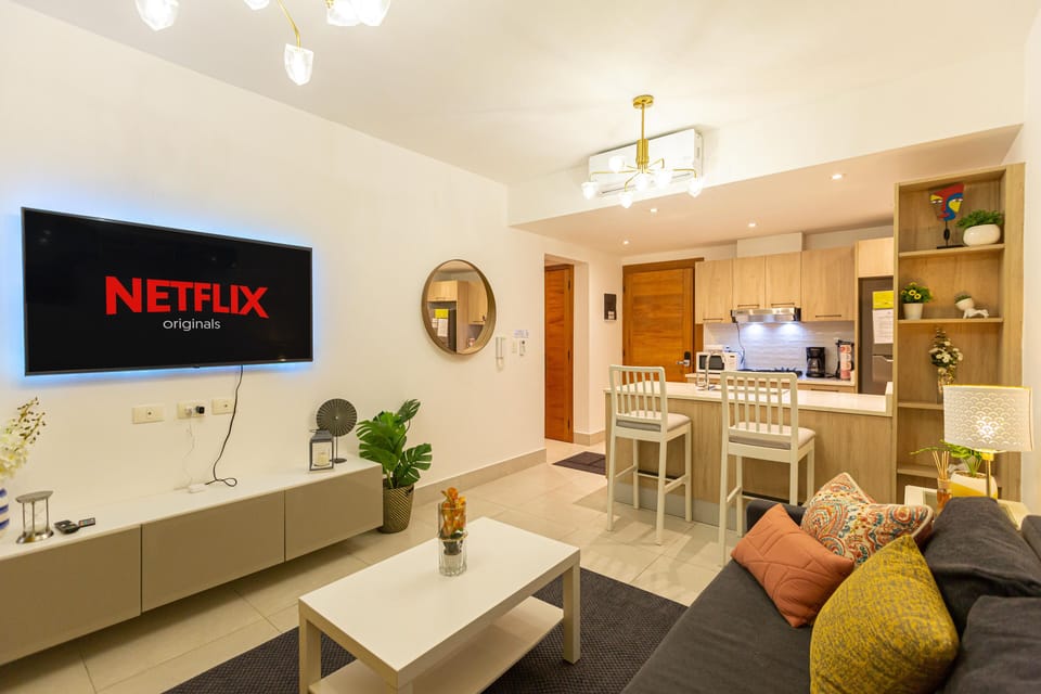 Living Room: Bright space with modern decor, perfect for relaxing and streaming your favorites!