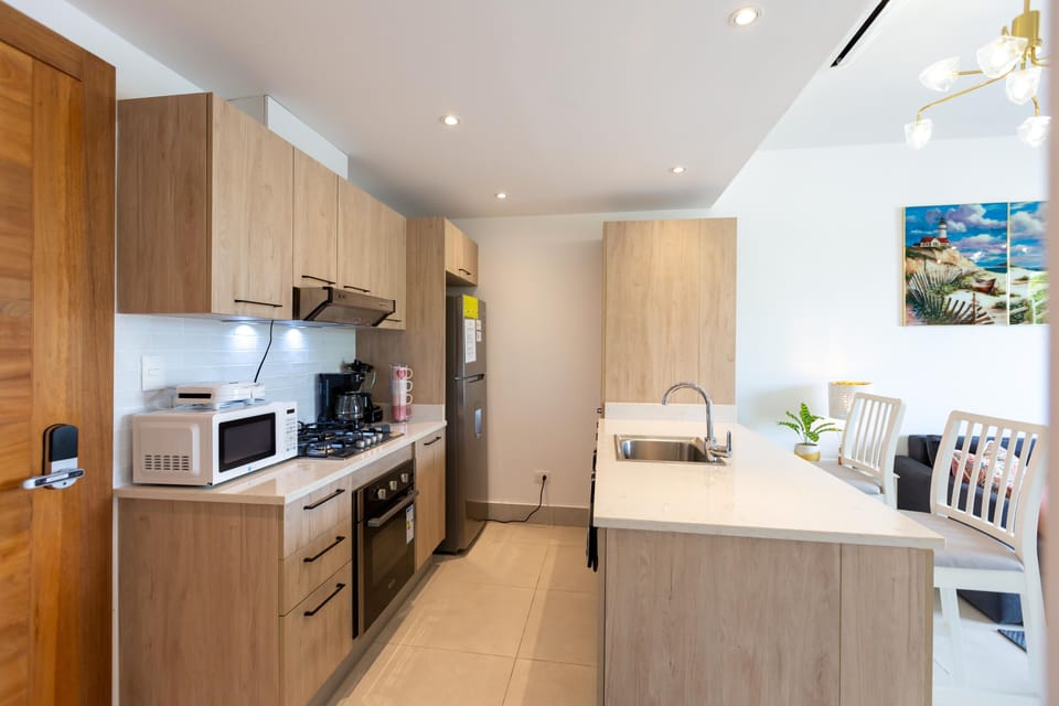 Kitchen: Modern design with sleek finishes, perfect for culinary adventures under bright lighting!