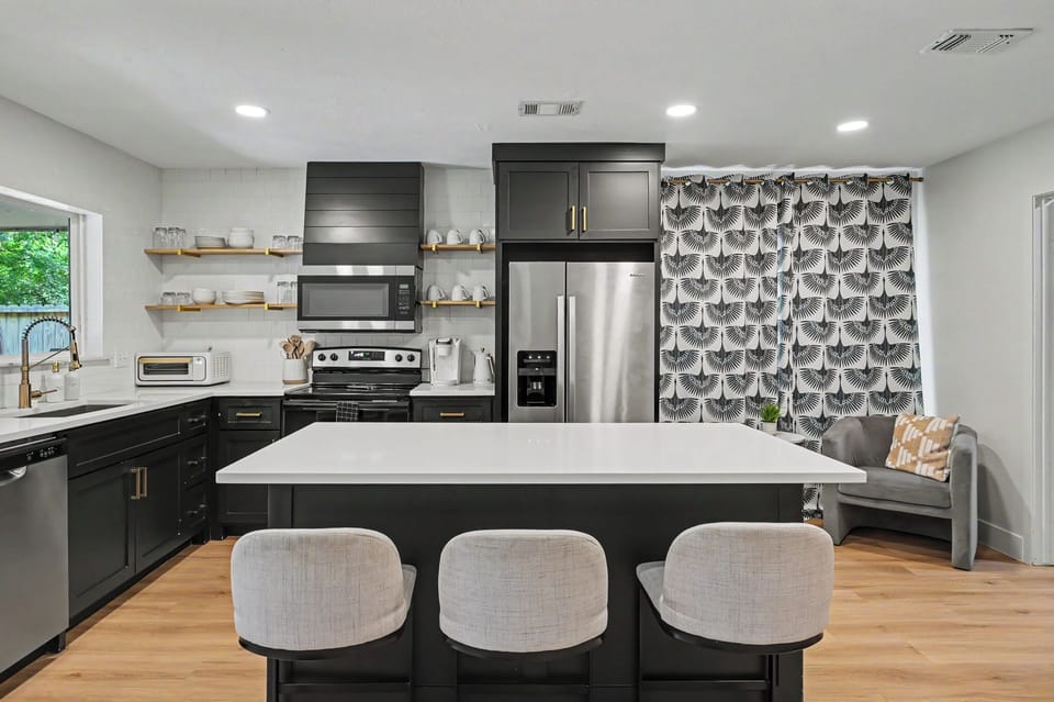 Recently updated, modern design.  Cozy furniture, luxury vinyl plank floors, bright space with high ceilings.