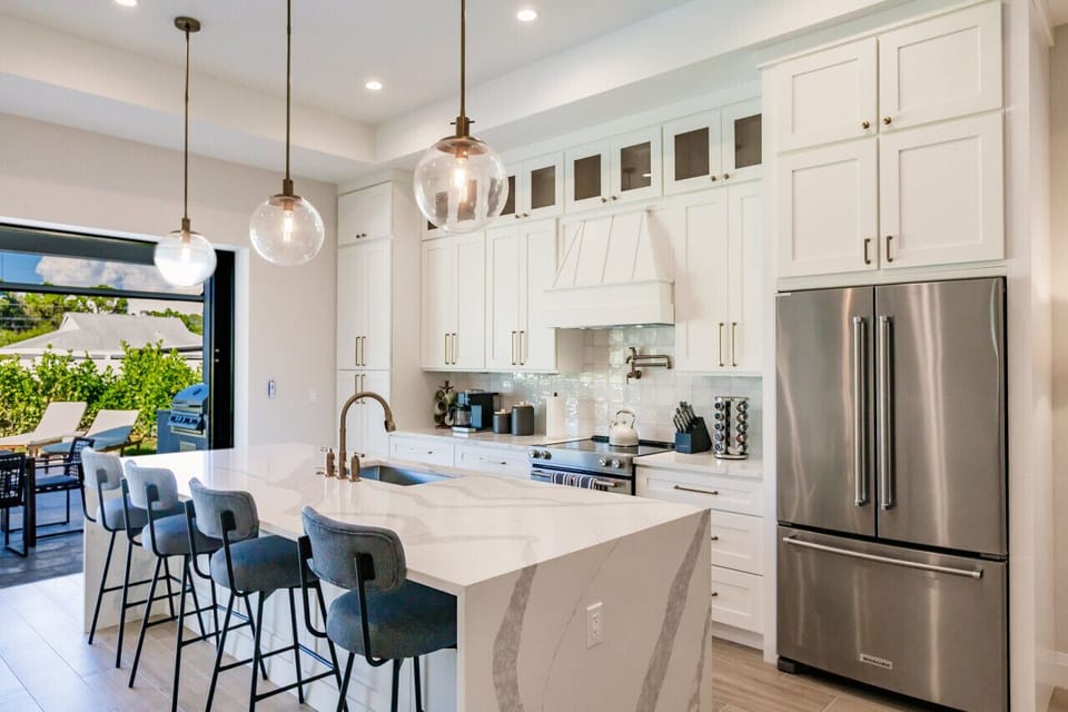 Gourmet Kitchen with Waterfall Kitchen Island