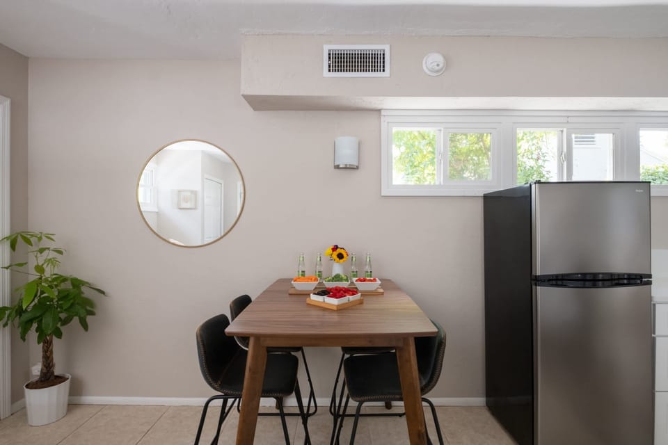 Gather for a meal or a morning coffee at this stylish wooden dining table. With comfortable seating for four and a bright, airy feel, it’s the perfect spot to plan your day's adventures.