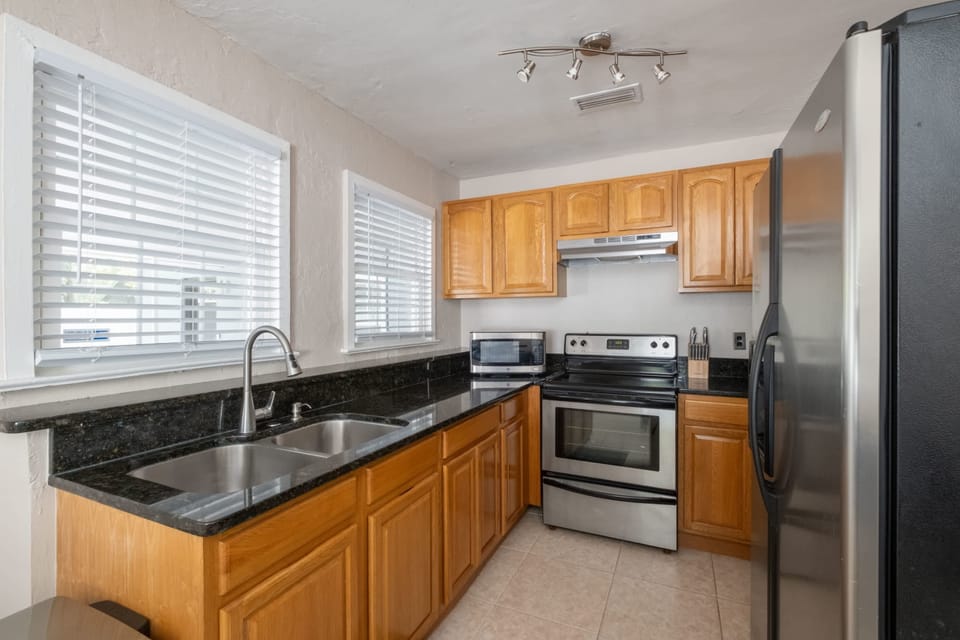 Cook up a feast in our fully equipped kitchen featuring sleek stainless steel appliances and ample granite counter space.
