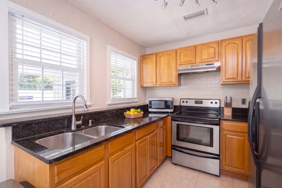 Cook up a feast in our fully equipped kitchen featuring sleek stainless steel appliances and ample granite counter space.