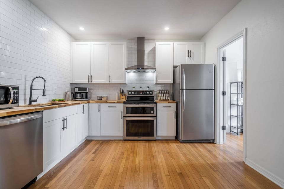 A bright, fully-equipped culinary space designed for effortless hosting.