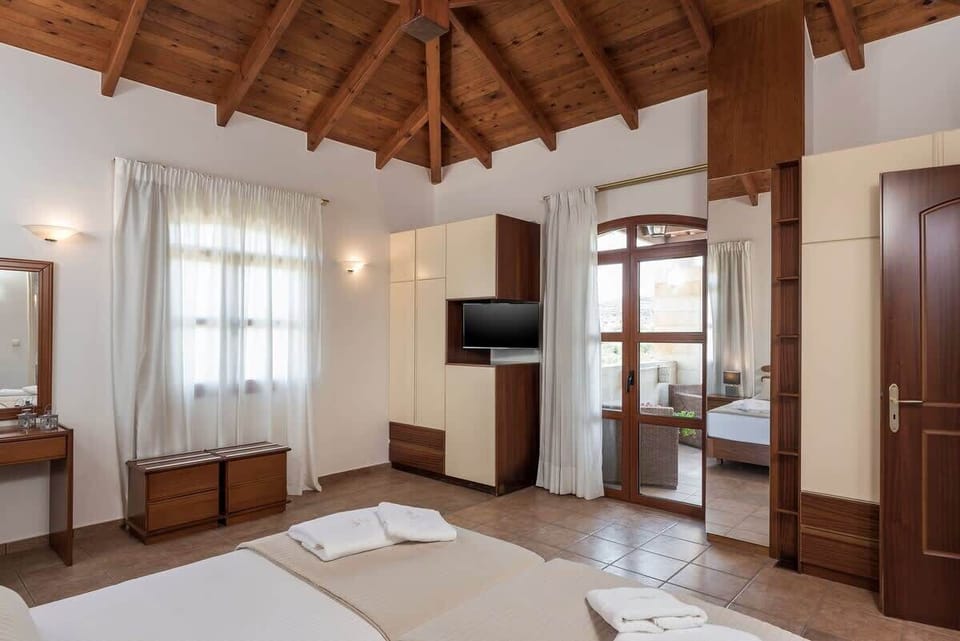 Sophisticated Bedroom with Balcony View and Functional Wardrobe