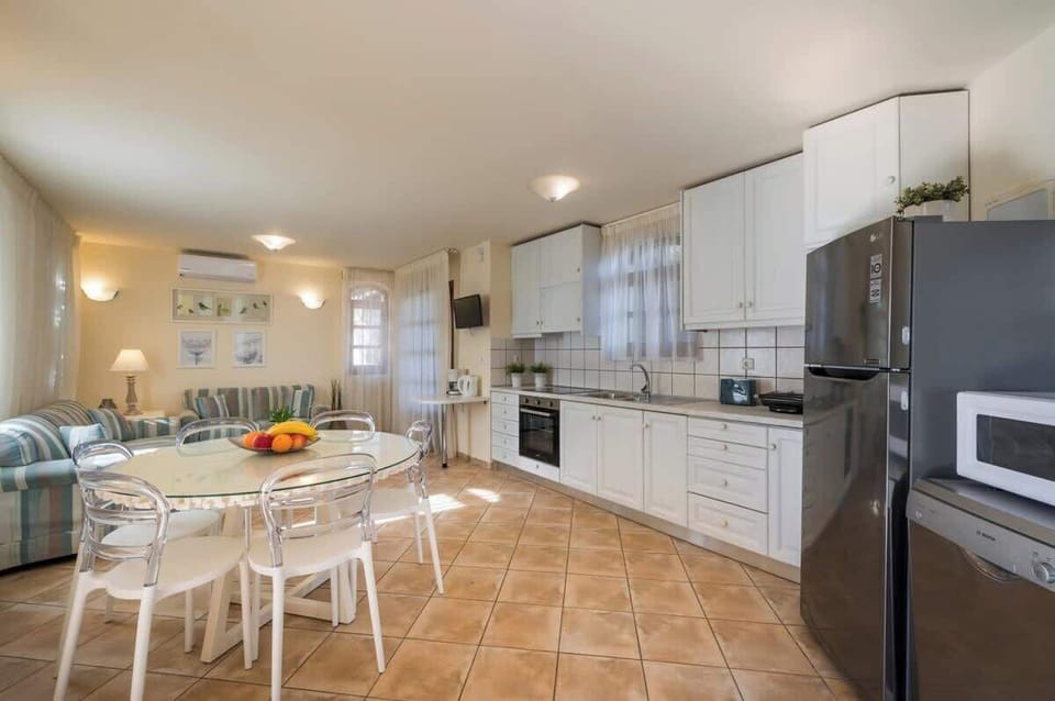 Well-Appointed Kitchen with Comfortable Dining Setup