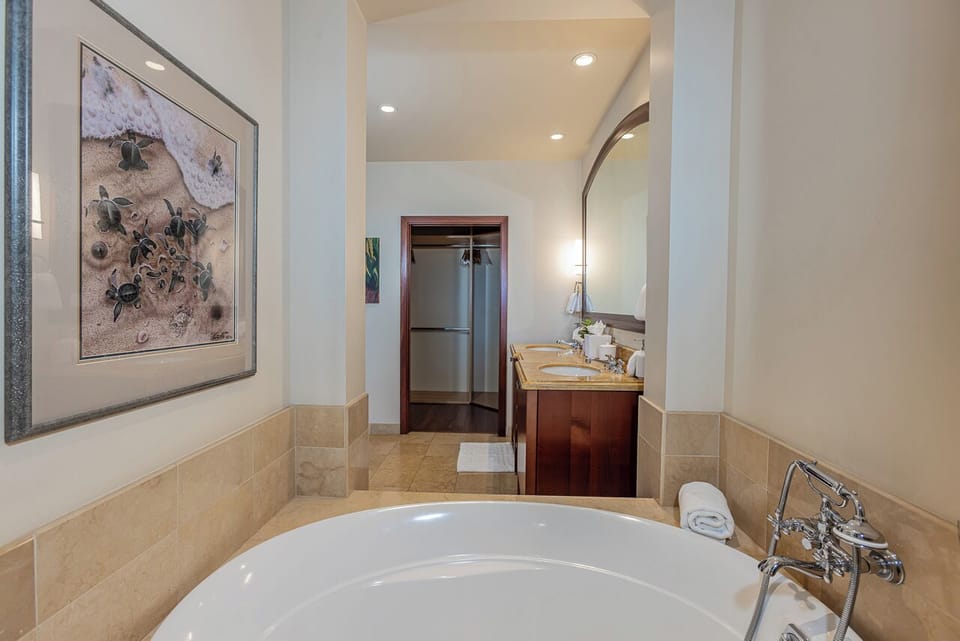 Slip into your private soaking tub for a luxurious retreat, with elegant marble surrounds and thoughtful touches to help you unwind completely.