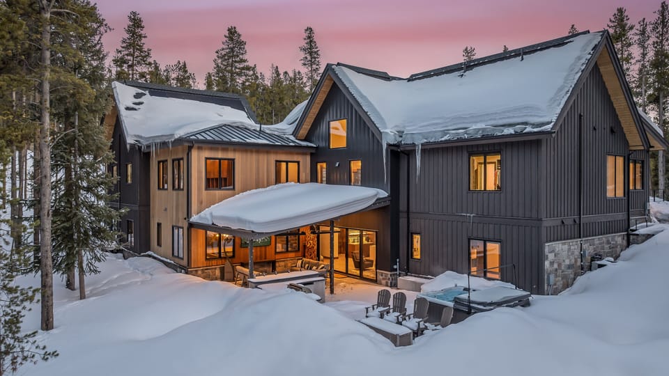 Winter aerial of Trailblazer Lodge back patio with second hot tub