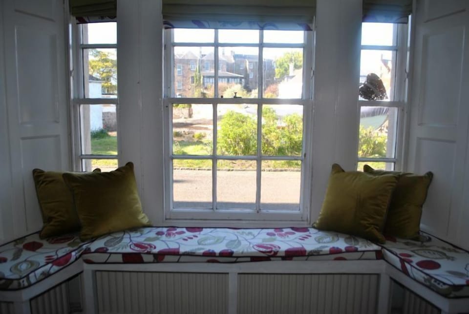 Relax in the kitchen and watch the world go by from the window seat