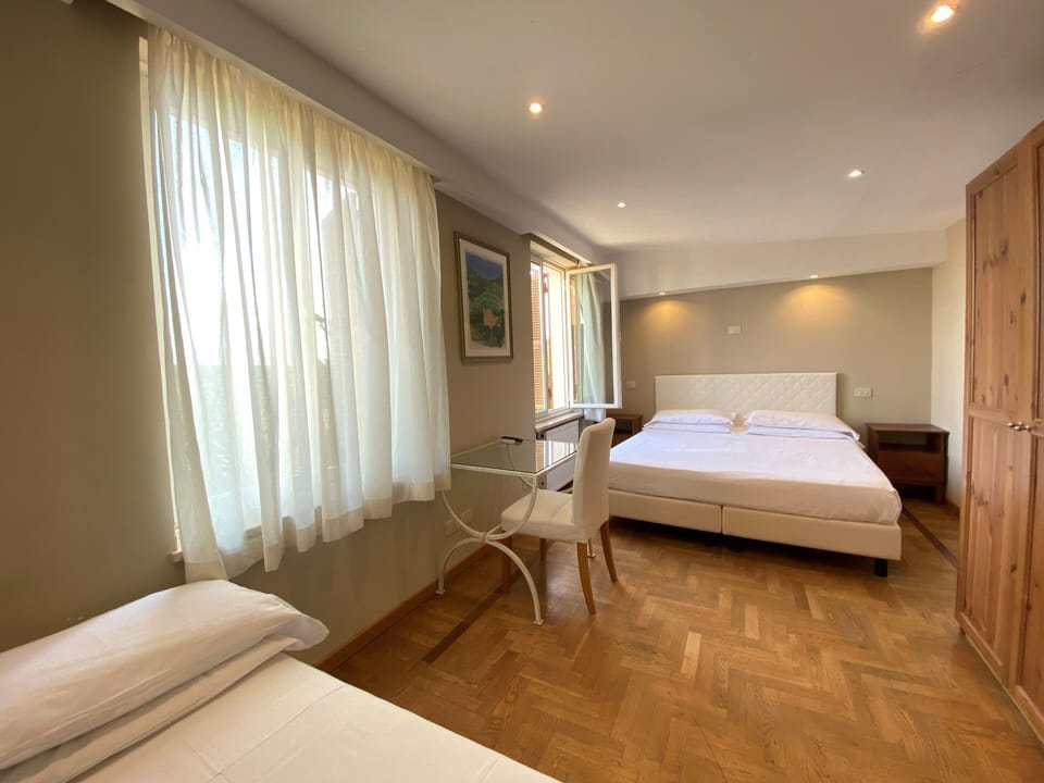 Standard Triple Room | Desk, laptop workspace, WiFi (free), bed sheets