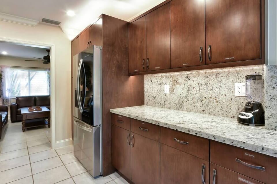 Kitchen has plenty of storage and large granite counters