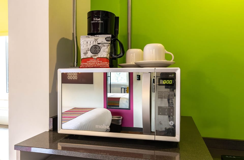 Suite, 1 Queen Bed, Non Smoking | Private kitchen | Mini-fridge, microwave, cookware/dishes/utensils