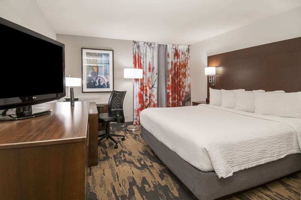 Suite, 1 Bedroom | Desk, laptop workspace, blackout drapes, iron/ironing board